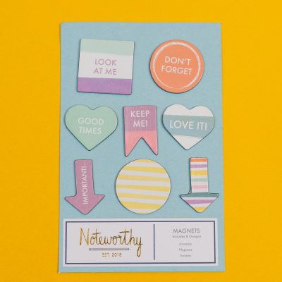pastel magnets on yellow background